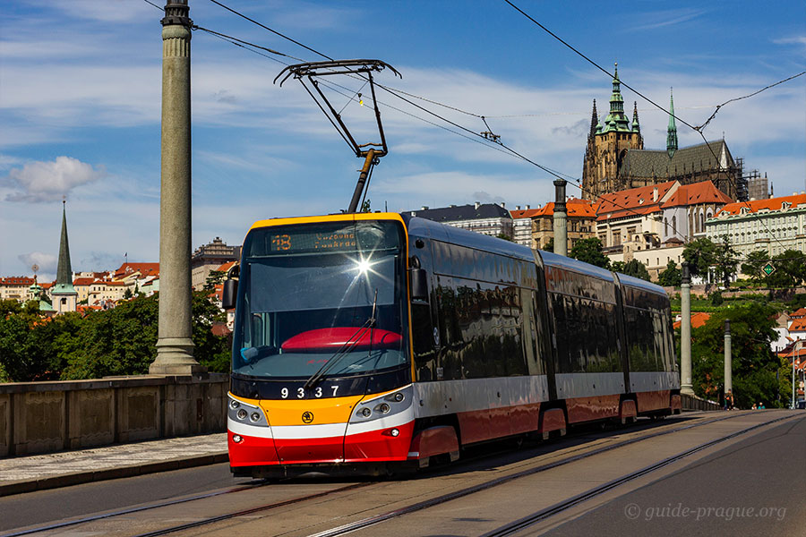 Photo of a tram, Prague Castle on the background